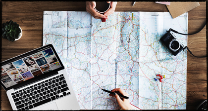 Map, Laptop, Camera, Pen on Desk for Wide Lens Projects